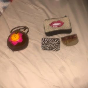 One coconut purse, two coin purses and one cosmetics bag